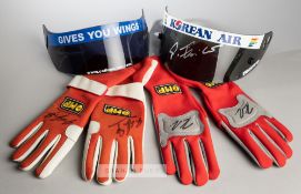 Two pairs of F1 drivers gloves, one pair signed by Michael Schumacher and the other by Felipe Massa,