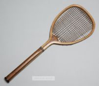 An early flat topped lawn tennis racquet by William et Cie, circa 1885, with copper collar and small