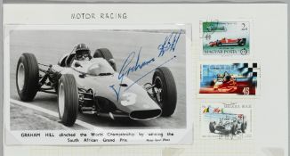 Superb signed b&w photographic card of Graham Hill winning the South African Grand Prix clinching