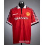 Manchester United red replica home jersey signed by the 1998-99 Treble winning squad, embroidered