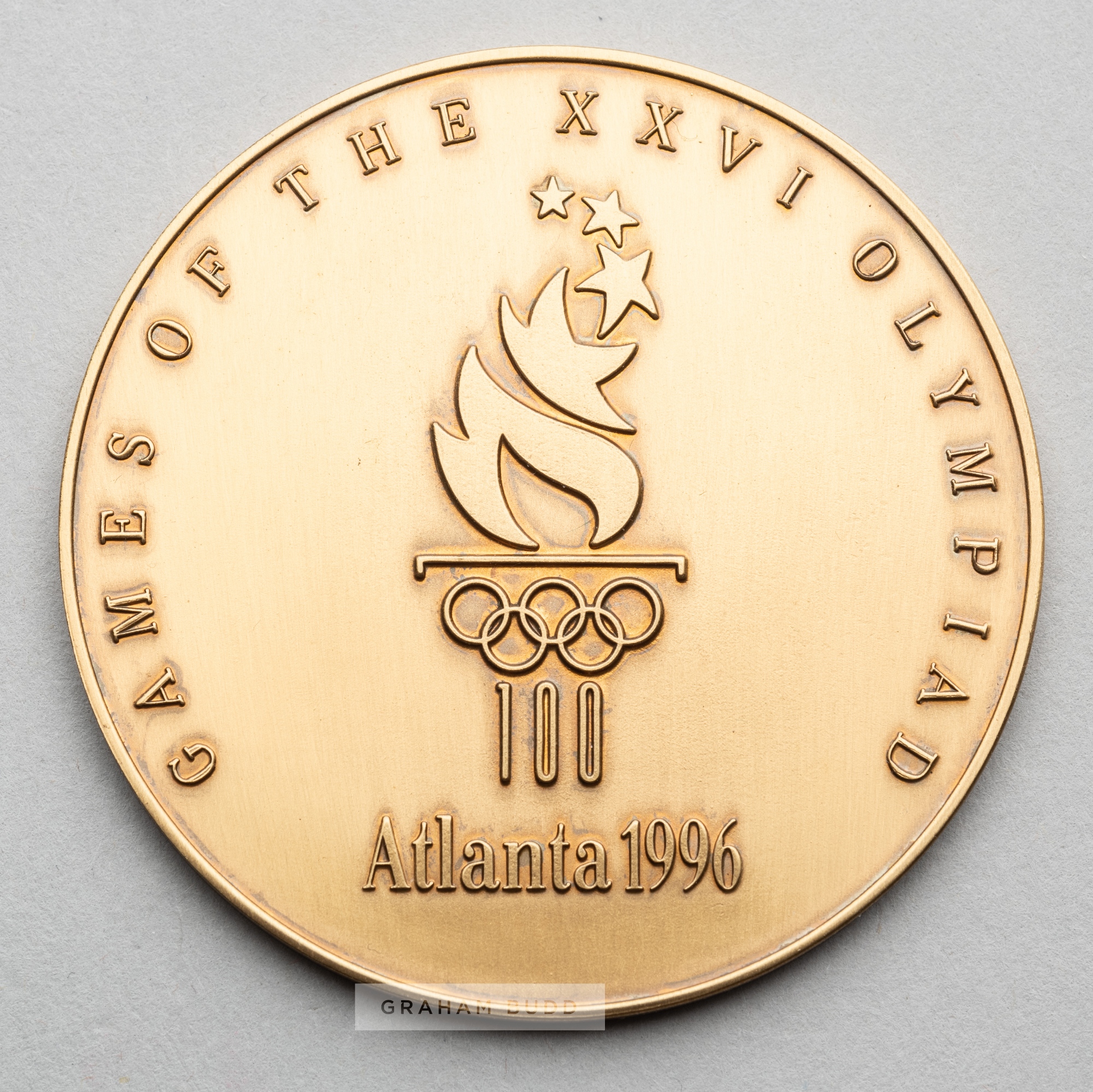 Atlanta 1996 Olympic Games participant's medal, designed by M. Grear, bronze, obverse with