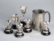 Five silver trophies awarded to the golfer Tom Haliburton between 1932 and 1936, comprising