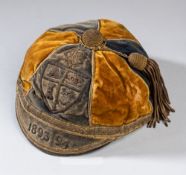 Westmorland County representative cap, 1893-94, gold and navy velvet cap with gilt tassel and