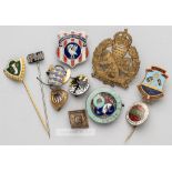 Eleven miscellaneous badges awarded to the Football Association official H.H. Hughes,  including one