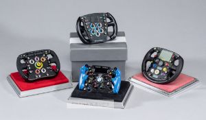 Sixteen Amalgam 1:4 scale F1 steering wheels, including 6 Ferrari, 2 McLaren, 2 Renault, 2 Williams,