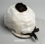 Jockey cap movie prop from the 2003 Hollywood movie 'Seabiscuit', the white cap with black bow above