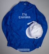 Godolphin royal blue silks, with white change-colour cap, embroidered FLY EMIRATES logo on the front