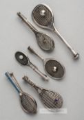 Six English and Continental silver tennis racquet brooches,  two with silver tennis ball on strings,