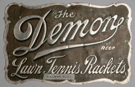 An extremely rare (only known example) embossed advertising tin for “The Demon” Reg. Lawn Tennis