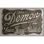 An extremely rare (only known example) embossed advertising tin for “The Demon” Reg. Lawn Tennis