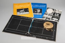 Lawn tennis memorabilia, comprising: an unwinding Lawn Tennis Measure, bearing a cross-arrows