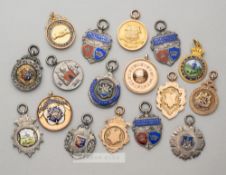 Collection of silver and gold football medals dating from 1911-12 to 1937-38, comprising Lancs &