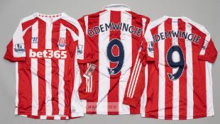 Three Peter Odemwingie signed Stoke City football jerseys, comprising red and white Stoke City no.