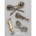 Four tennis brooches,  comprising three white metal brooches, two of crossed racquets with pin clasp