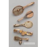 Four 9ct gold tennis racquet brooches,  two featuring tennis ball on strings, one without and