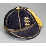 England Schools' F.A. representative cap, navy velvet with yellow tassel and gilt braiding,