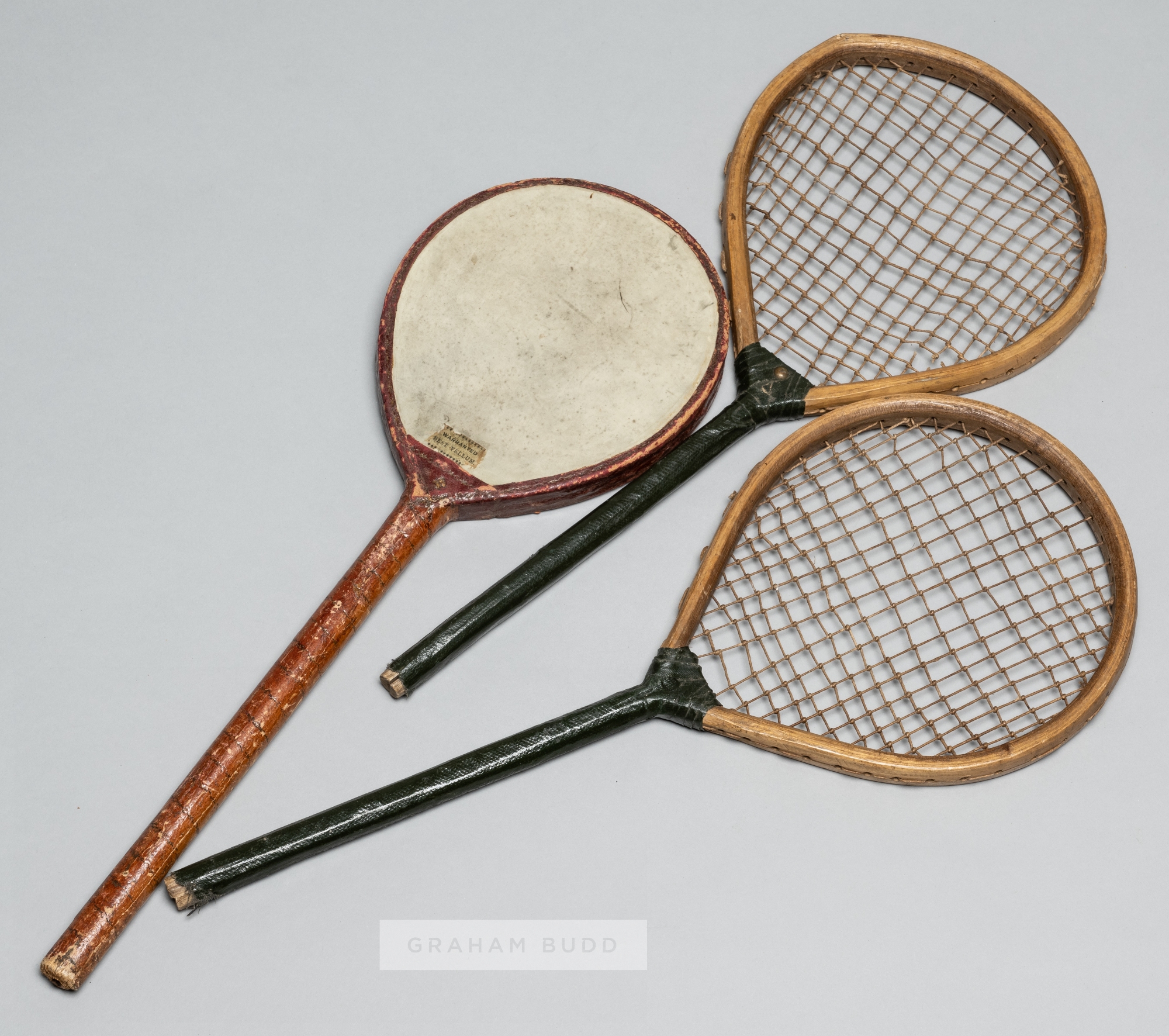 Pair of tennis play racquets, circa 1880, 48 by 20cm; sold together with a rare battledore,