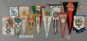 A group of eleven South American international football pennants originally owned by Sir Alf Ramsey,