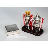 Two miniature trophies commemorating Arsenal's Double Winning season 2001-02, comprising Premiership