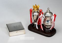 Two miniature trophies commemorating Arsenal's Double Winning season 2001-02, comprising Premiership