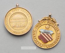 Two Manchester football medal's awarded to P Moon, comprising Manchester City F.C. medal to
