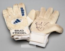 Brad Friedel signed Adidas goalkeeper's gloves,  white and cream gloves with BRAD FRIEDEL printed on