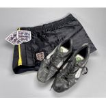 A pair of Peter Shilton Puma football boots from Derby County's 1990-91 season, black and white