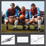 Photograph signed by West Ham United's 1966 World Cup winning trio Bobby Moore, Geoff Hurst and