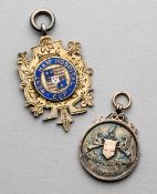 Two medals awarded to J O Drummond of Ilford FC, both in silver-gilt, one enamelled for the West Ham