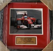 Fernado Alonso (Spain) signed Ferrari framed 8 by 10in. action photograph, professionally framed /