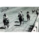Two Lester Piggott signed horse racing b&w photographs, the first featuring Lester Piggott after