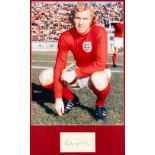 England's 1966 World Cup winning captain Bobby Moore signed photographic display, the photo