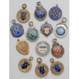 A group of medals relating to football in Reading, mostly in silver and enamel, others in bronze and