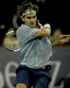 Roger Federer, The Greatest of All Time (GOAT) signed action 8 by 10in. tennis photograph, Signed in