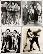 Boxing: Jack Johnson and George Godfrey four sepia 10 by 8in. heavyweight boxer photographs, two