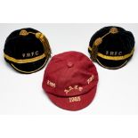 Three representative caps, circa 1920s, comprising red wool cap with cream initials A.A.C.C. and