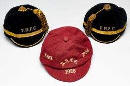 Three representative caps, circa 1920s, comprising red wool cap with cream initials A.A.C.C. and