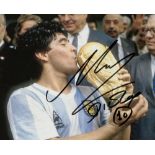 Diego Maradona signed photograph, 7 by 9in. colour portraying Maradona kissing the World Cup
