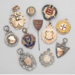A collection of medals and badges relating to Schools and Junior football,  including three examples