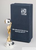 FIFA Women's 2011 Germany World Cup miniature trophy, modelled as a silvered ball upon a gilt spiral