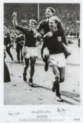 1966 World Cup celebration b&w print signed by Hunt, Charlton & Ball, featuring Charlton carrying