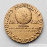 A rare FIFA 1934 World Cup official participation medal awarded to Dr Mario Tortarolo, obverse