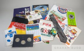 A collection of World Cup memorabilia 1982 to 2006, including coins, postcards, clothing, occasional