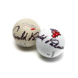 Two Arnold Palmer signed golf balls