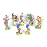 A group of seven German Volkstedt porcelain jester and minstrel figures