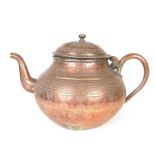 A large Indo Persian copper teapot.
