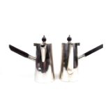 A pair of silver plated cafe au lait coffee pots designed by Christopher Dresser