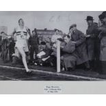 Bannister, Roger British Signed Photograph by Roger Bannister of him finishing the epic under four m