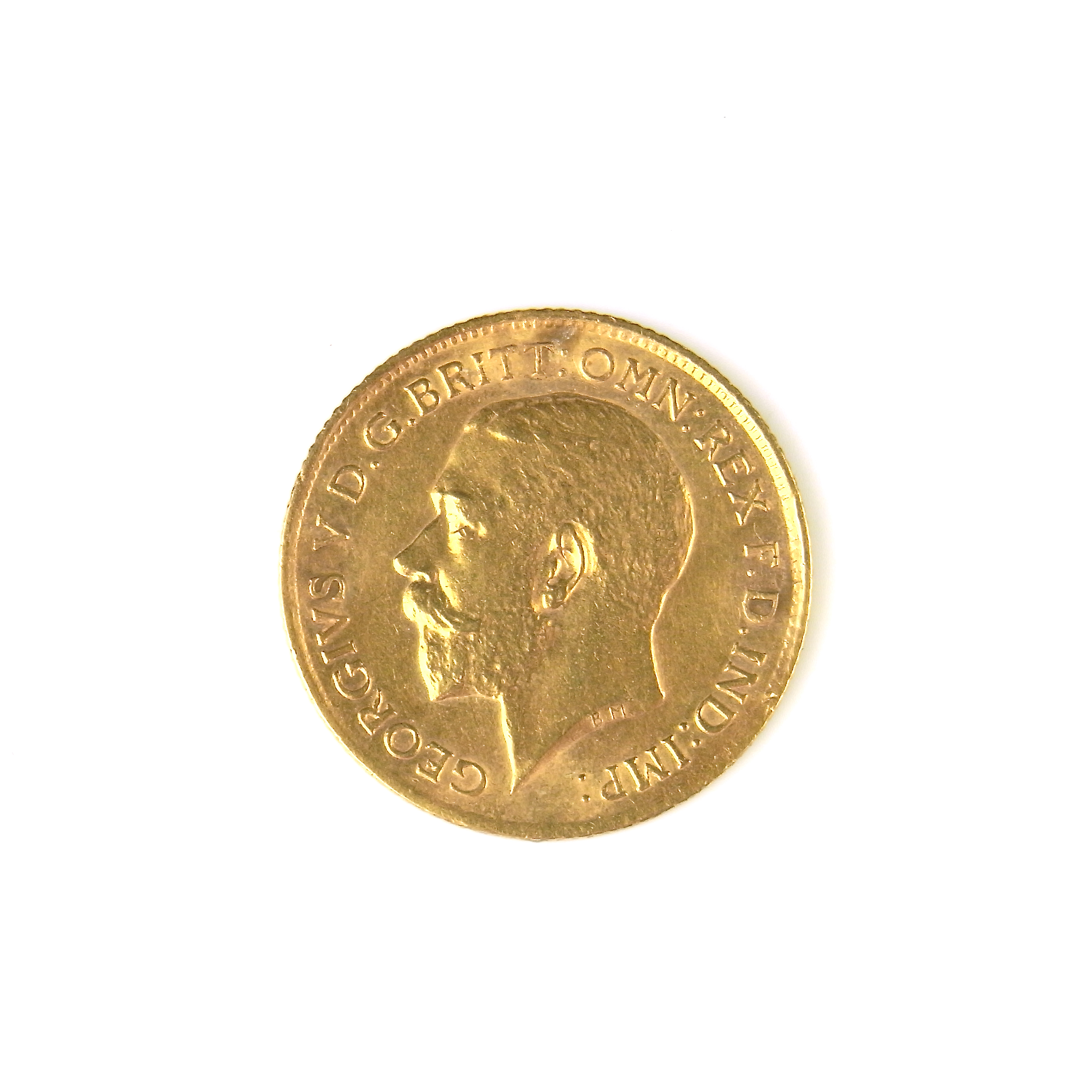 Gold half sovereign coin.