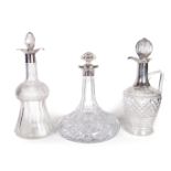 Three English silver topped glass decanters